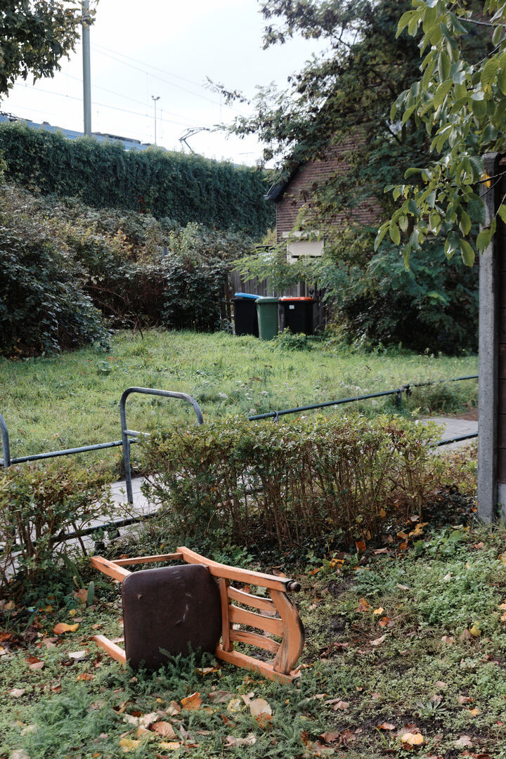 A chair three bins and a train