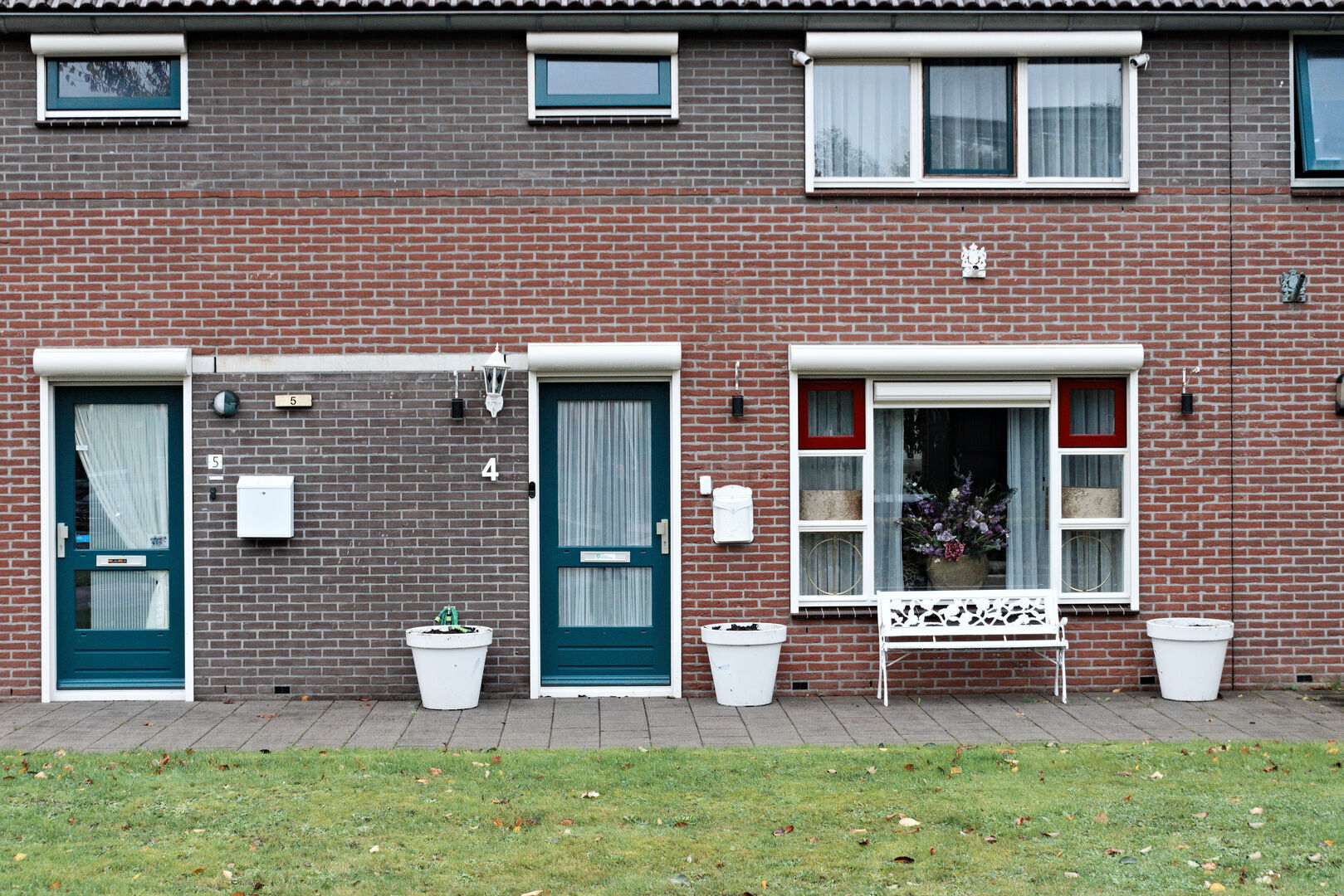 Two front doors and a bench